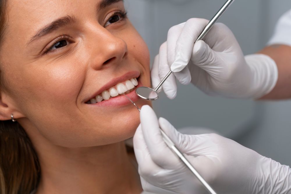 Dentist examining patient's smile during dental check-up.